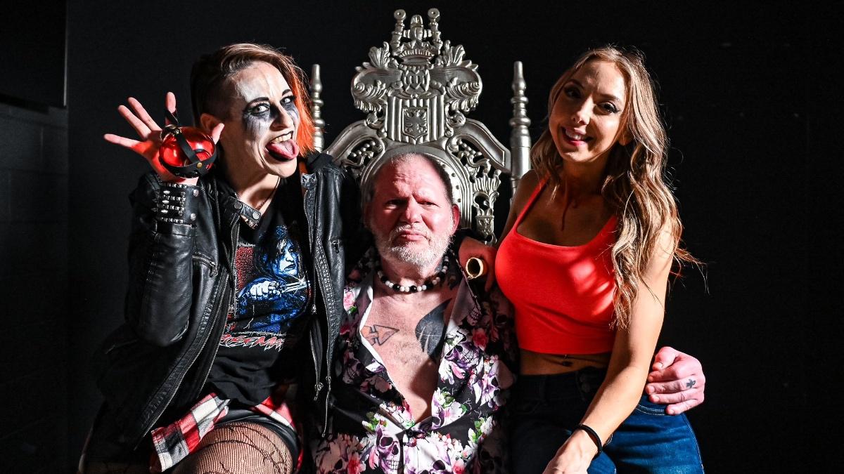 Rosemary sitting on a throne with Rosemary on his left and Allie on his right