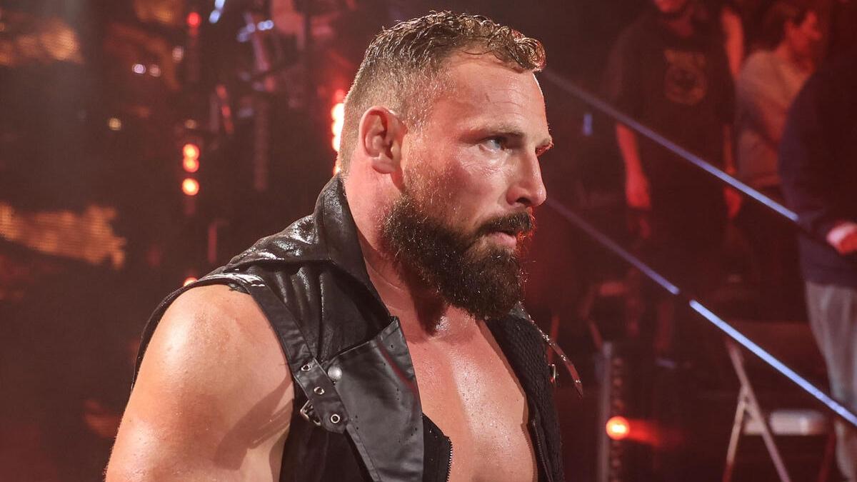 Ring Holland waring a leather vest making his entrance on WWE NXT