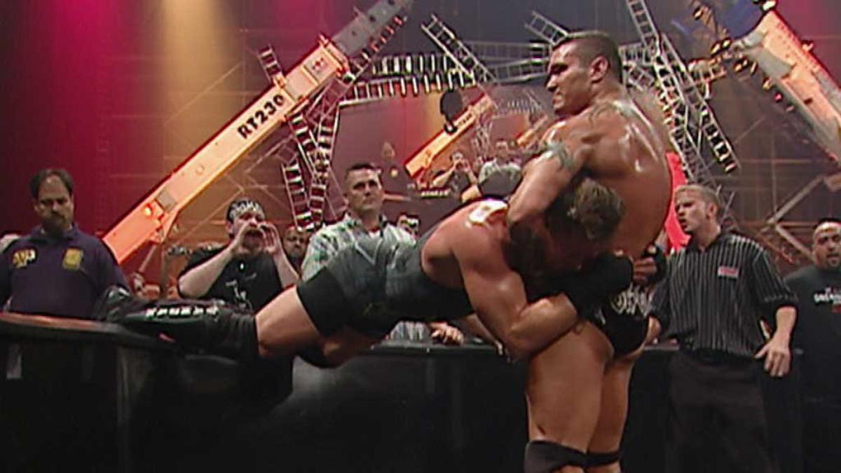 Randy Orton about to hit a barricade-assisted draping DDT to Rob Van Dam at One Night Stand 2007