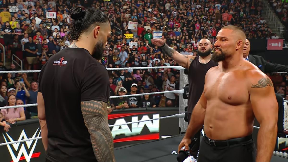 Bron Breakker staring at Roman Reigns as Reigns looks down on WWE Raw