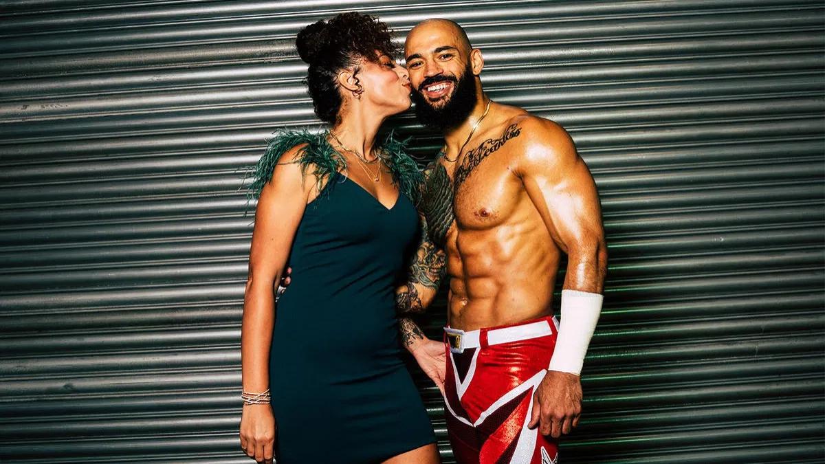 Samantha Irvin kissing a smiling Ricochet on the cheek