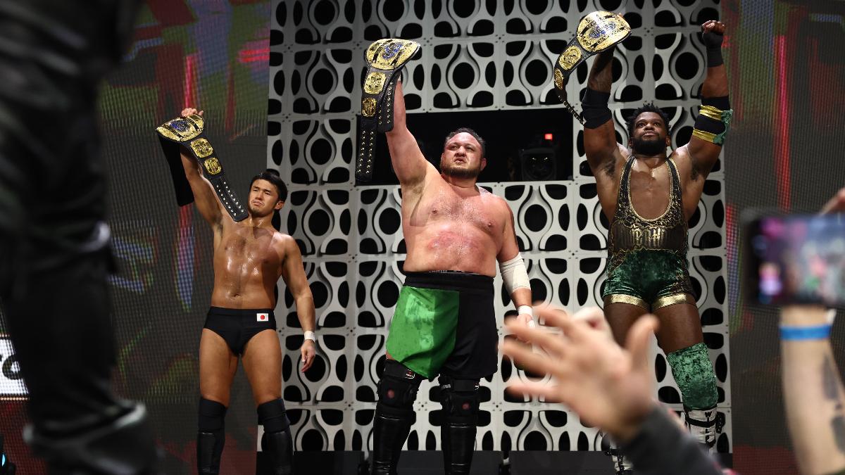 Samoa Joe, Powerhouse Hobbs and Katsuyori Shibata raising the AEW World Trios Titles