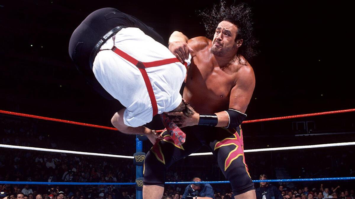 WWE star Samu gives IRS a hiptoss at SummerSlam 1994