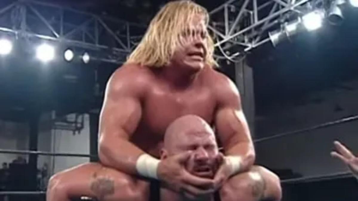 Shane Douglas with Pitbull No. 2 in a Camel Clutch at ECW Barely Legal