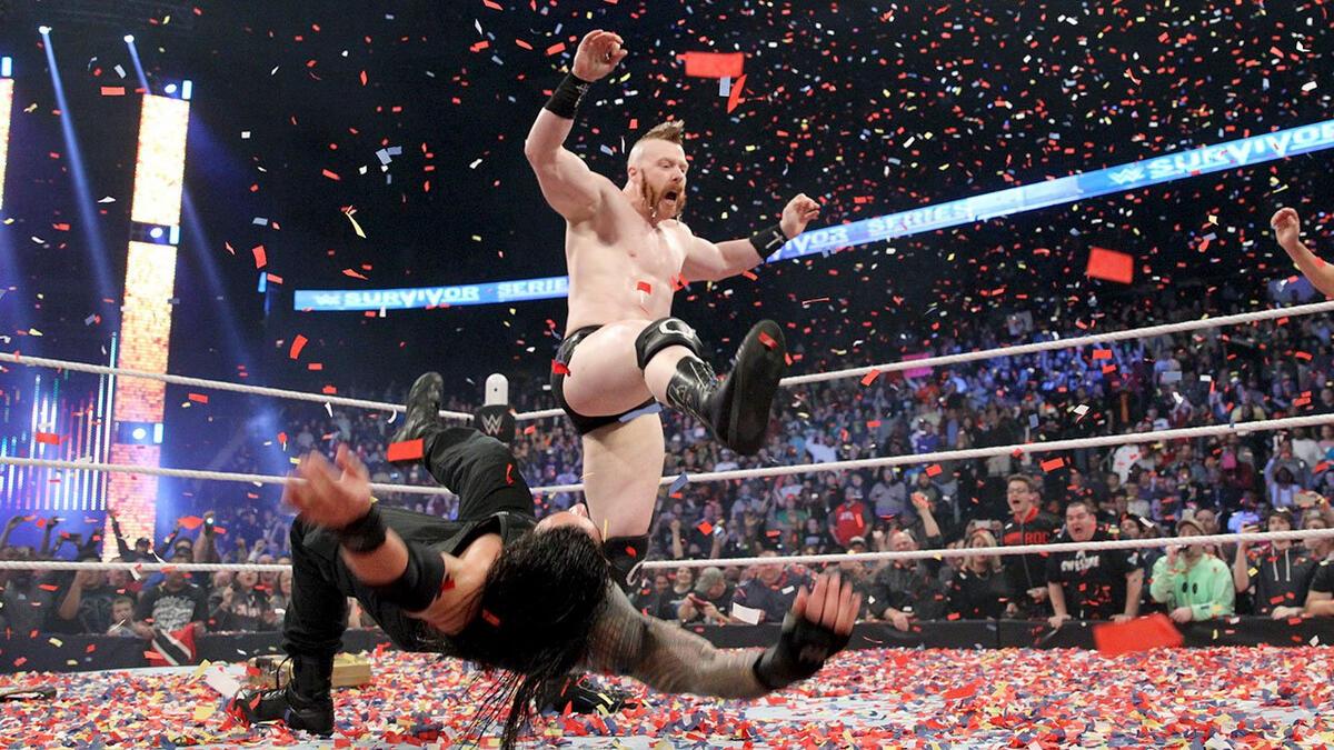 Sheamus hitting a Brogue Kick to Roman Reigns at WWE Survivor Series 2015