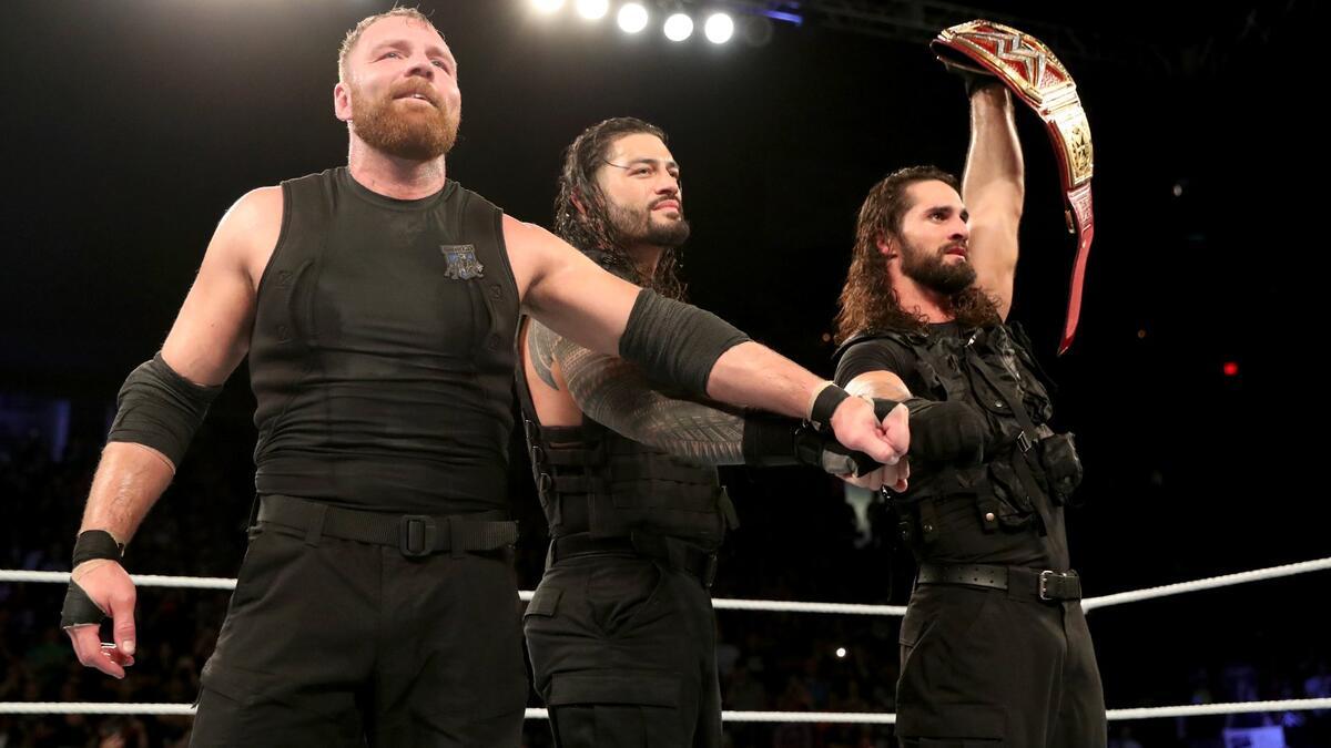Dean Ambrose, Roman Reigns and Seth Rollins putting their fists together at The Shield Final Chapter event