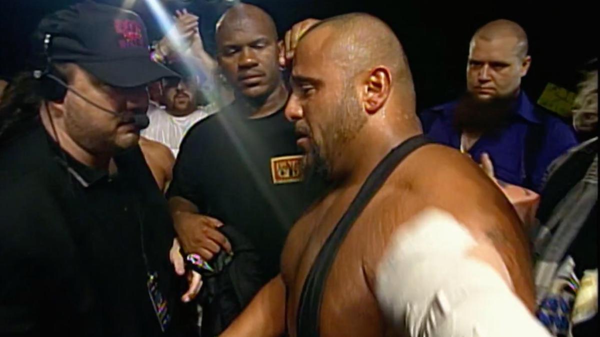Taz and Paul Heyman shaking hands at ECW Anarchy Rulz 1999