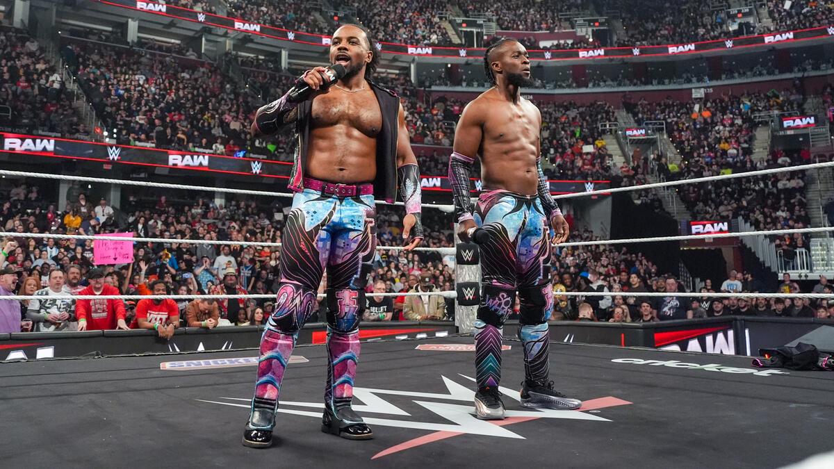 Xavier Woods and Kofi Kingston cutting a promo in the middle of the ring on WWE Raw in February 2025