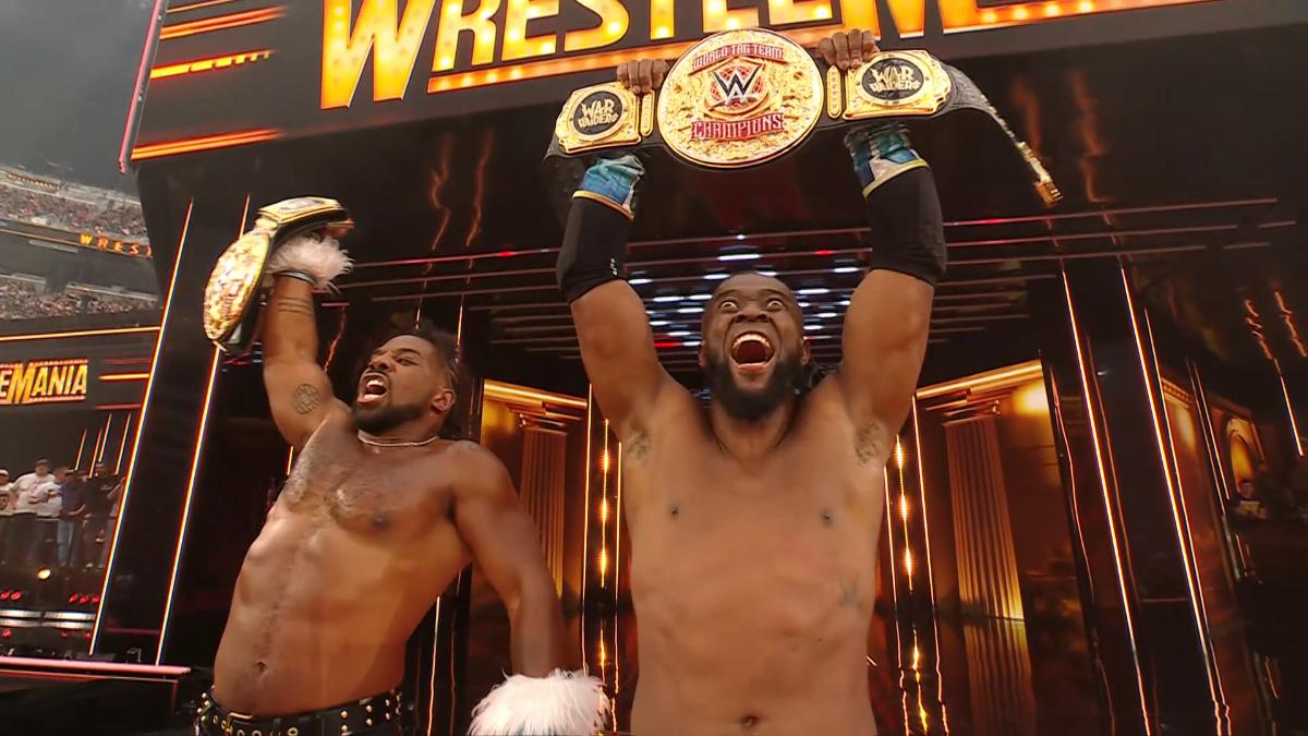 Xavier Woods and Kofi kingston hold the World Tag Team Championships aloft on the WWE WrestleMania 41 entrance stage