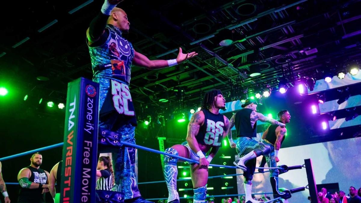 The Rascalz on the ring ropes posing 