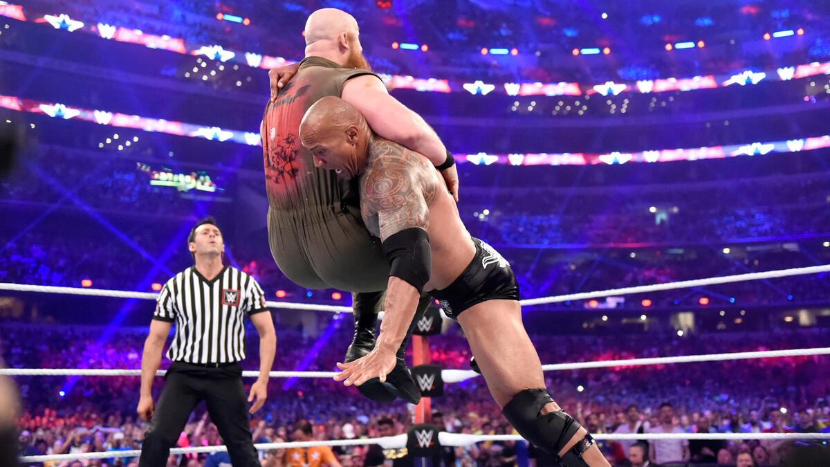 The Rock hitting Erick Rowan with a Rock Bottom at WWE WrestleMania 32