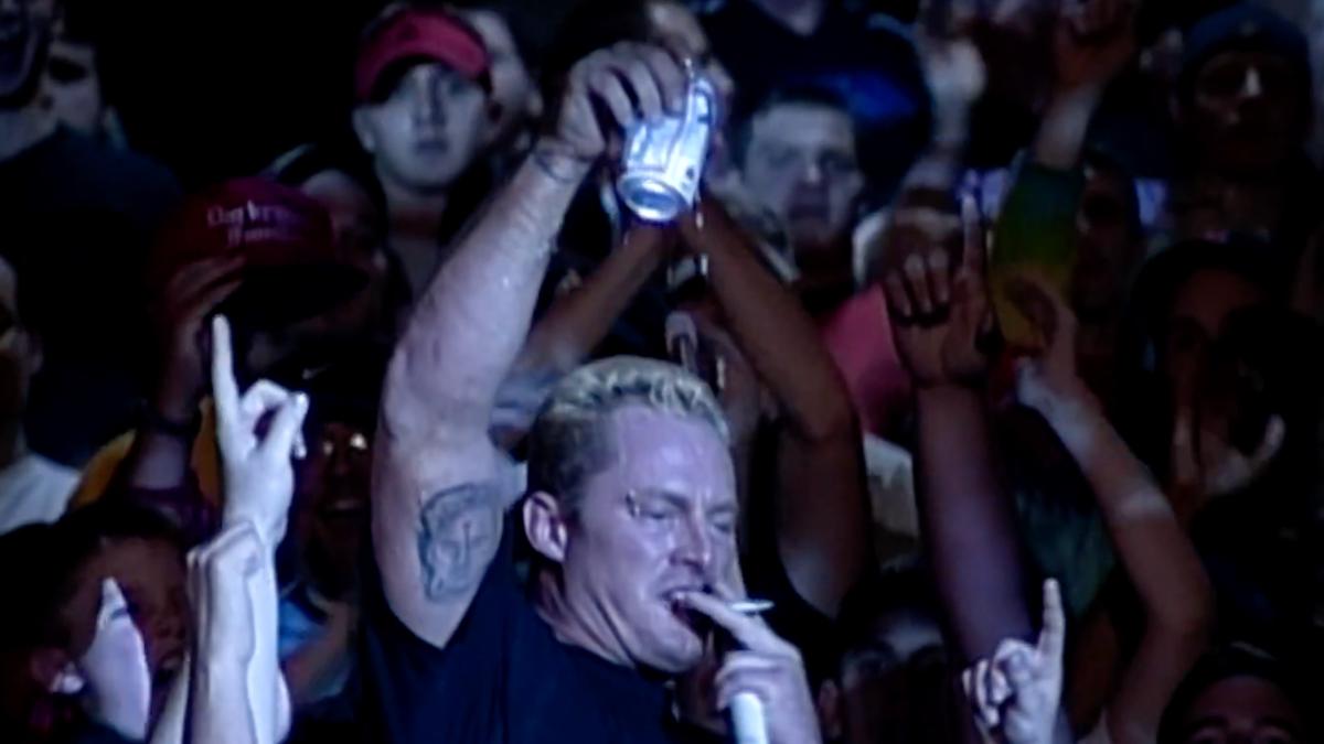 The Sandman holding up a beer can and smoking a cigarette at ECW November To Remember 1999