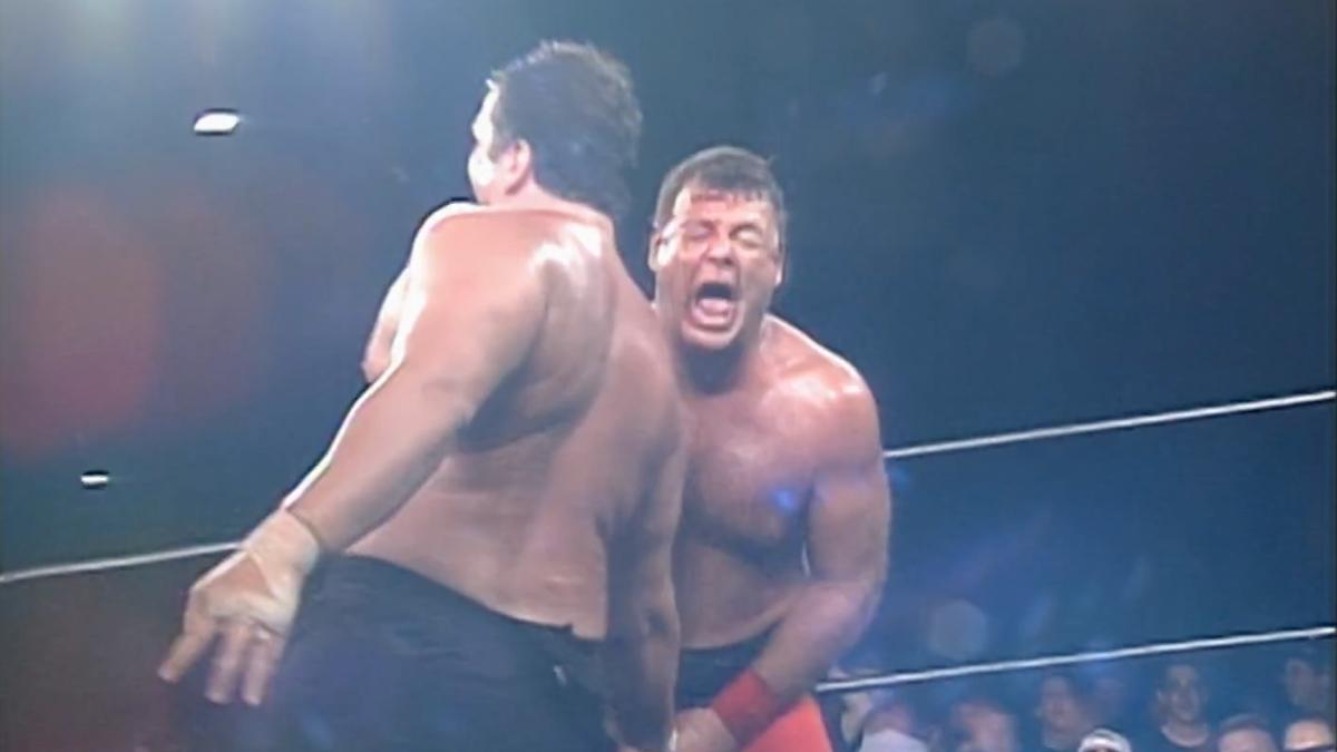 Tommy Dreamer grabbing Jerry Lawler's testicles, who is shrieking in pain