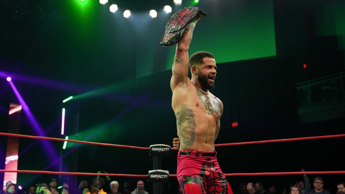 Trey Miguel holding up the TNA X-Division Title