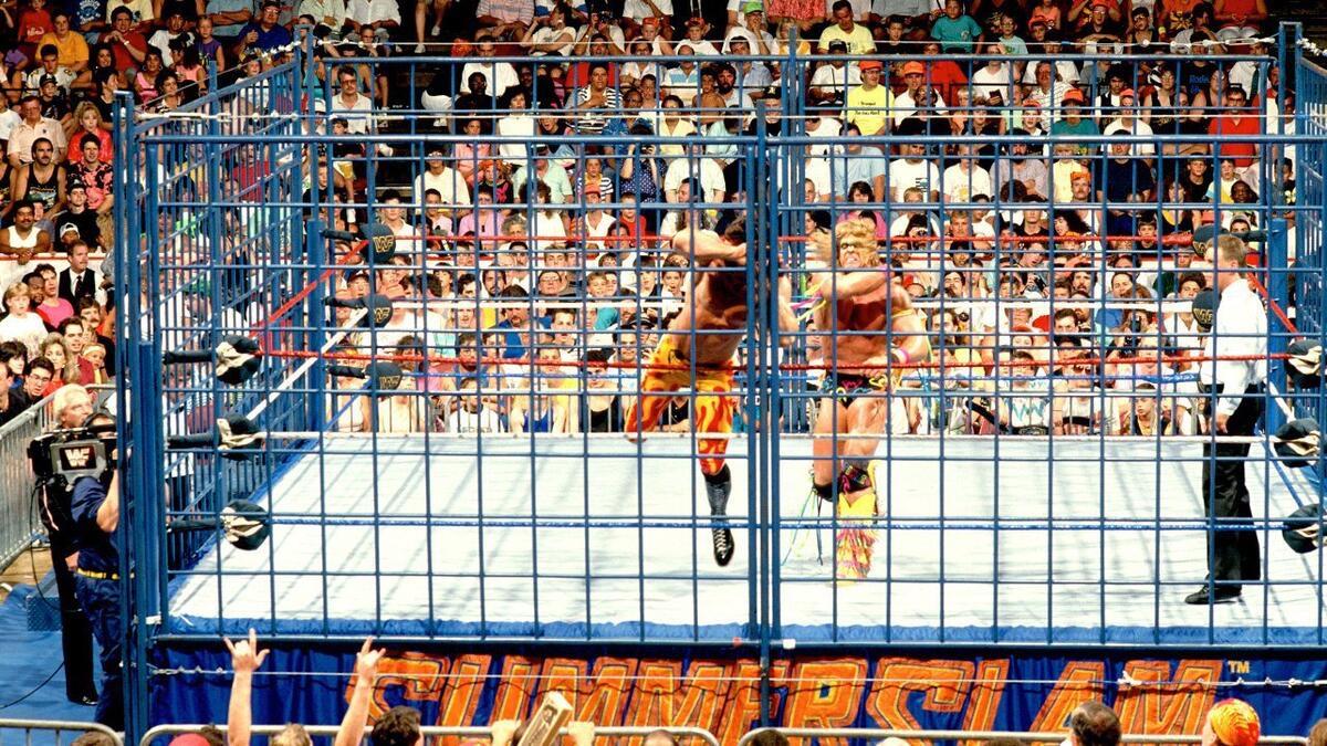 Ultimate Warrior throwing Rick Rude's head into the cage at WWE SummerSlam 1990
