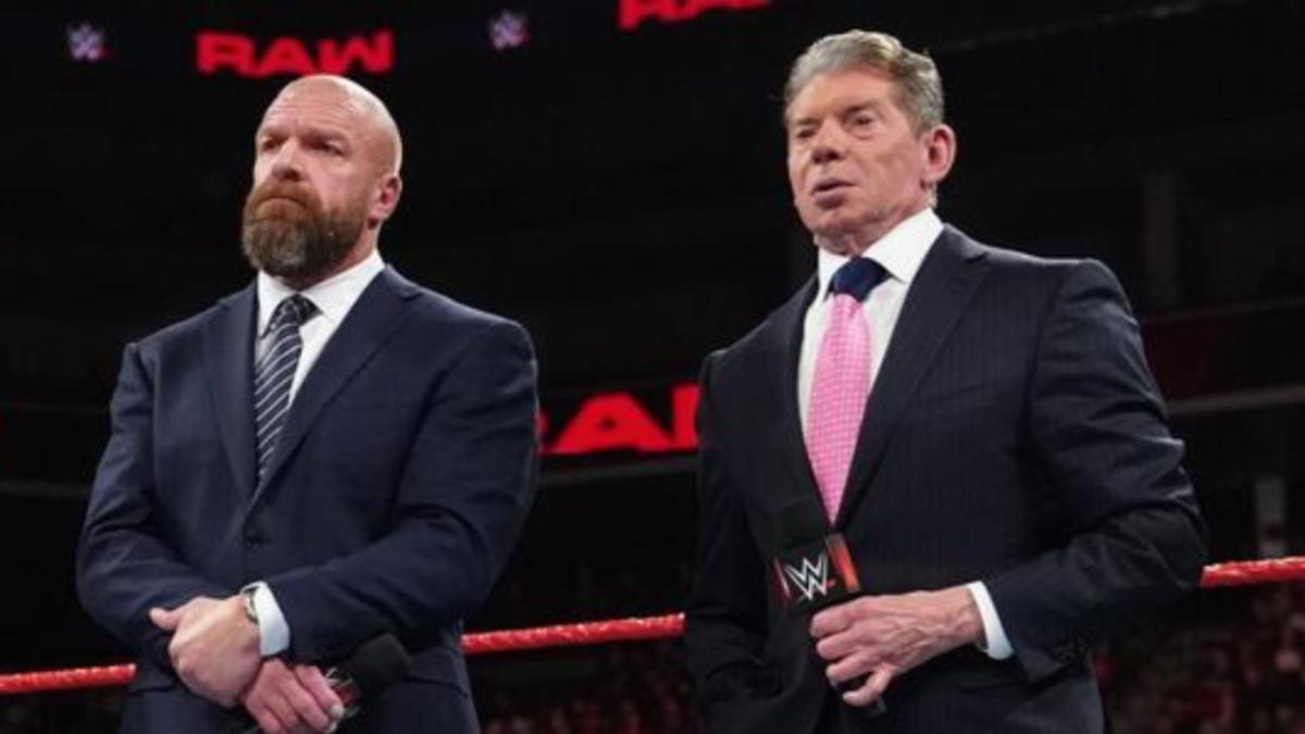 Triple H and Vince McMahon standing next to each other on 2018 episode of WWE Raw
