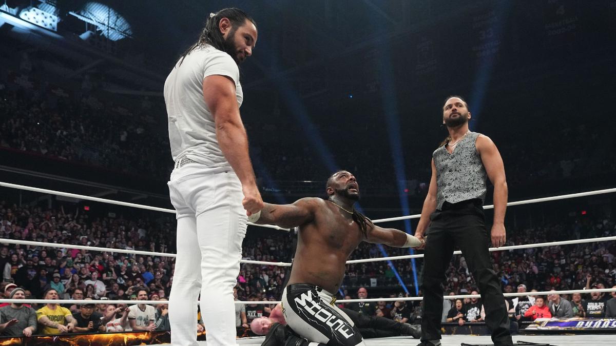The Young Bucks holding Swerve Strickland's arms at AEW Dynasty 2025
