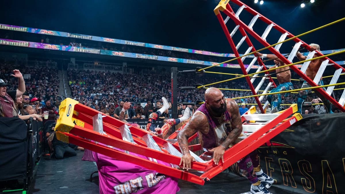 AJ Francis stuck in a ladder wincing in pain