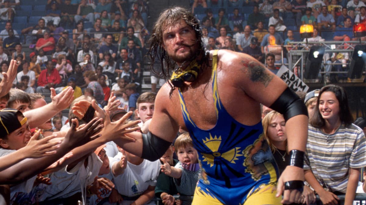 Adam Bomb high-fiving fans