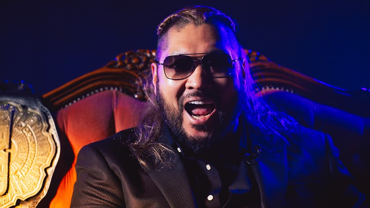 EVIL laughing while wearing sunglasses and a black suit