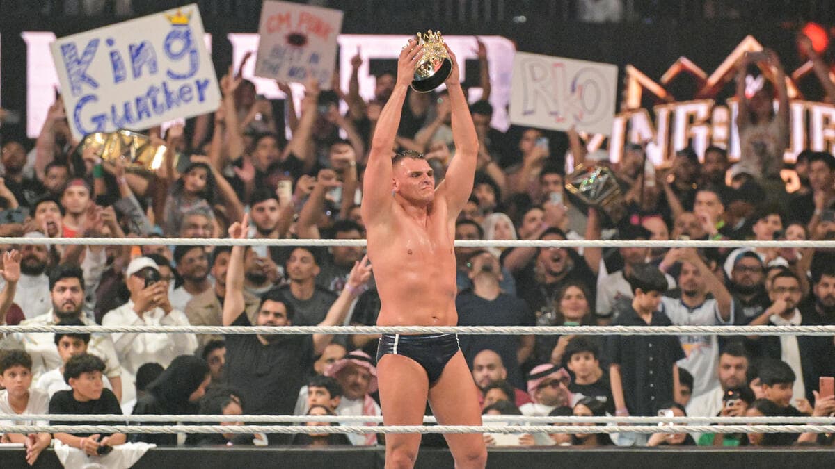 Gunther holding up the crown at WWE King of the Ring 2024