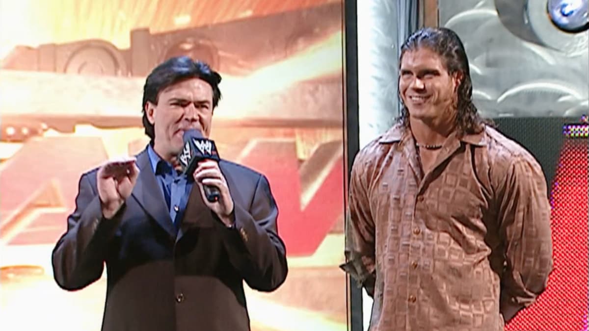 Eric Bischoff and Johnny Nitro standing together on the WWE entrance ramp