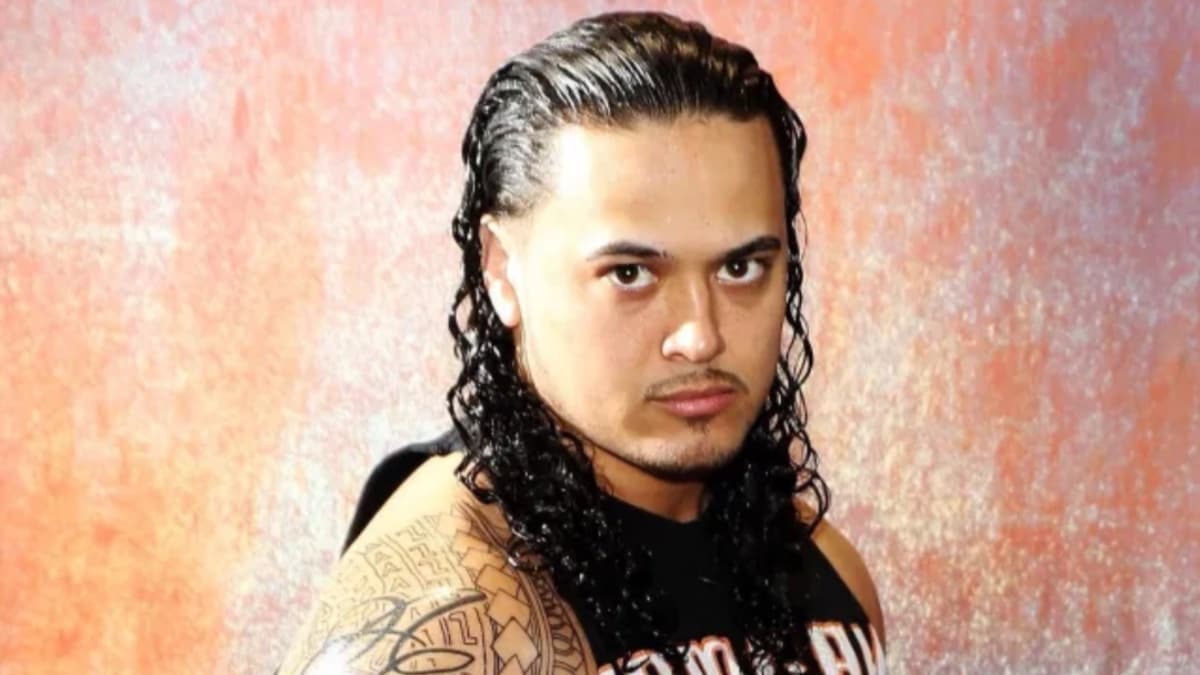 Lance Anoa'i with long black hair posing