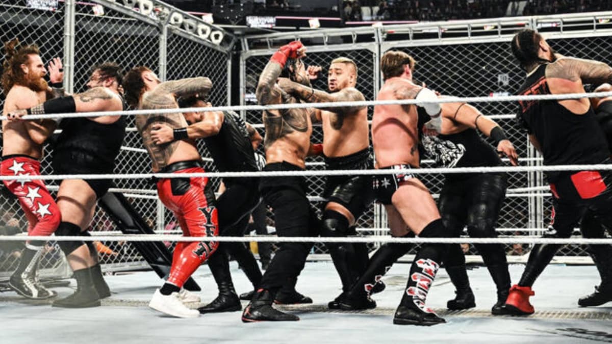Wrestlers brawling inside War Games