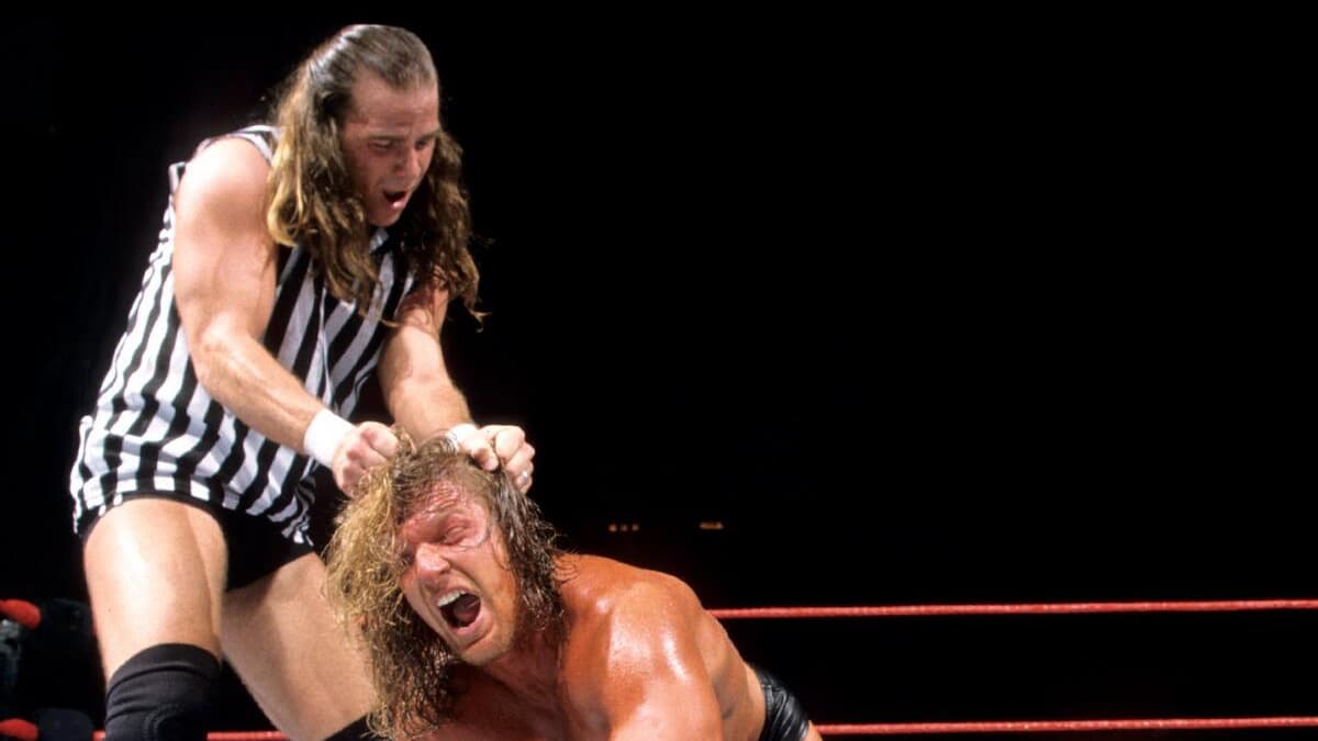 Shawn Michaels grabbing Triple H's hair at Judgment Day 2000