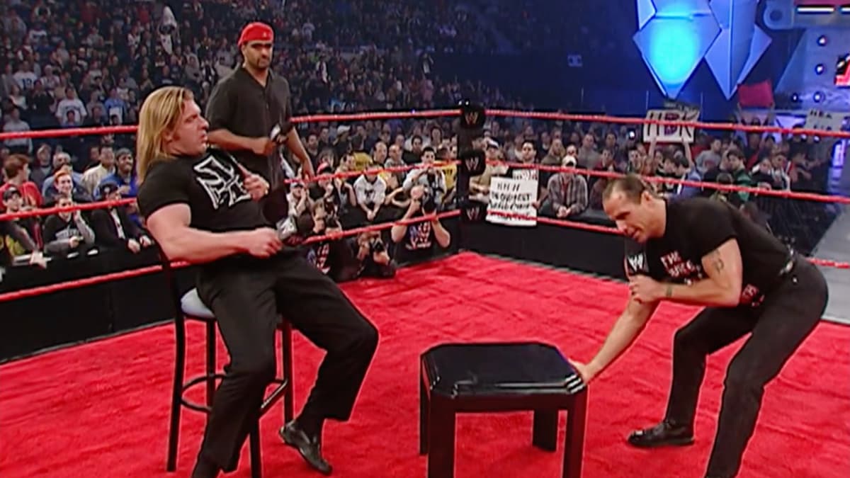 Triple H in a t-shirt, dress trousers and shoes on WWE Raw in January 2004