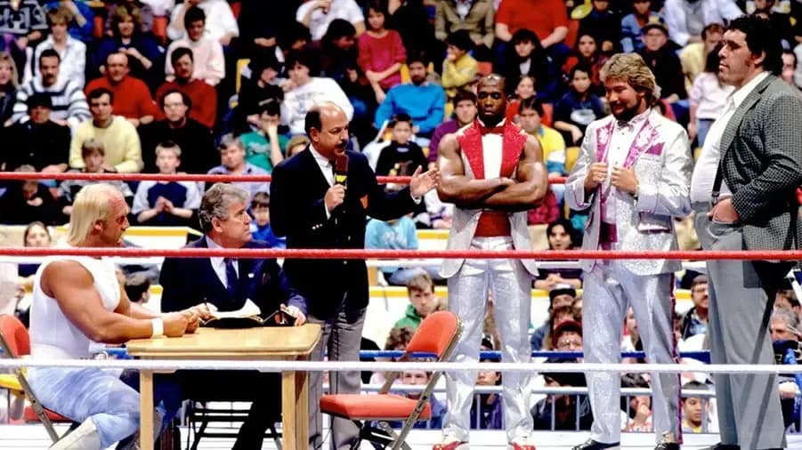 https://cultaholic.com/files/images/d157da485e8fab7765ff3f746e999d767914f8f6-royal-rumble-1988-hogan-andre-dibiase-virgil-okerlund.jpg