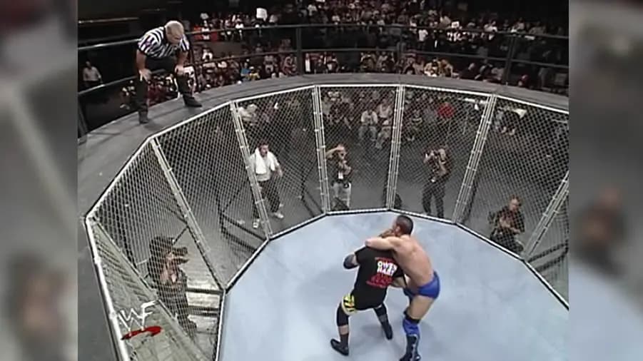 https://cultaholic.com/files/images/f27181c0d2f8fe4e499c5fcf7d7b8d64304b93ab-lions-den-match-owen-hart-ken-shamrock-summerslam-1998.jpg