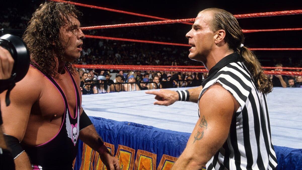 Bret Hart and Shawn Michaels berating each other at WWE SummerSlam 1997