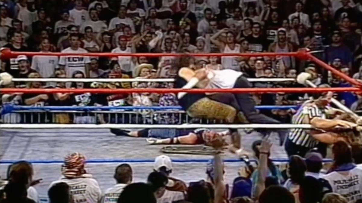 Cactus Jack hitting Tommy Dreamer with a double arm DDT