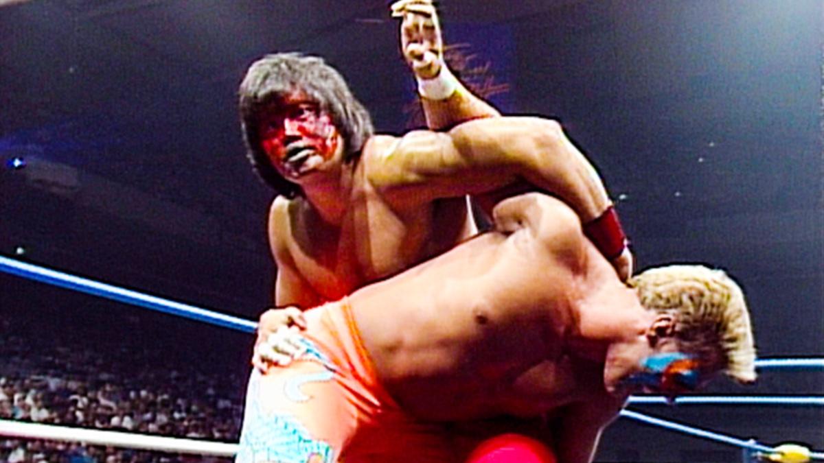 Great Muta with Sting in an abdominal stretch