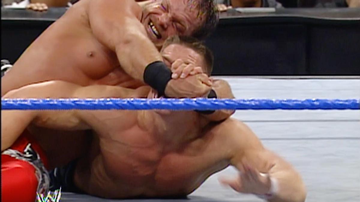 John Cena tapping out to a Crippler Crossface from Chris Benoit