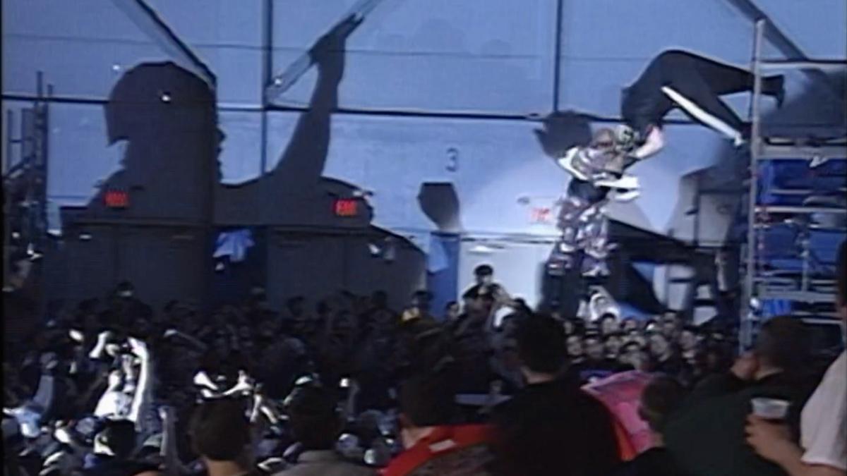 Wide shot of New Jack and Vic Grimes falling from a scaffold