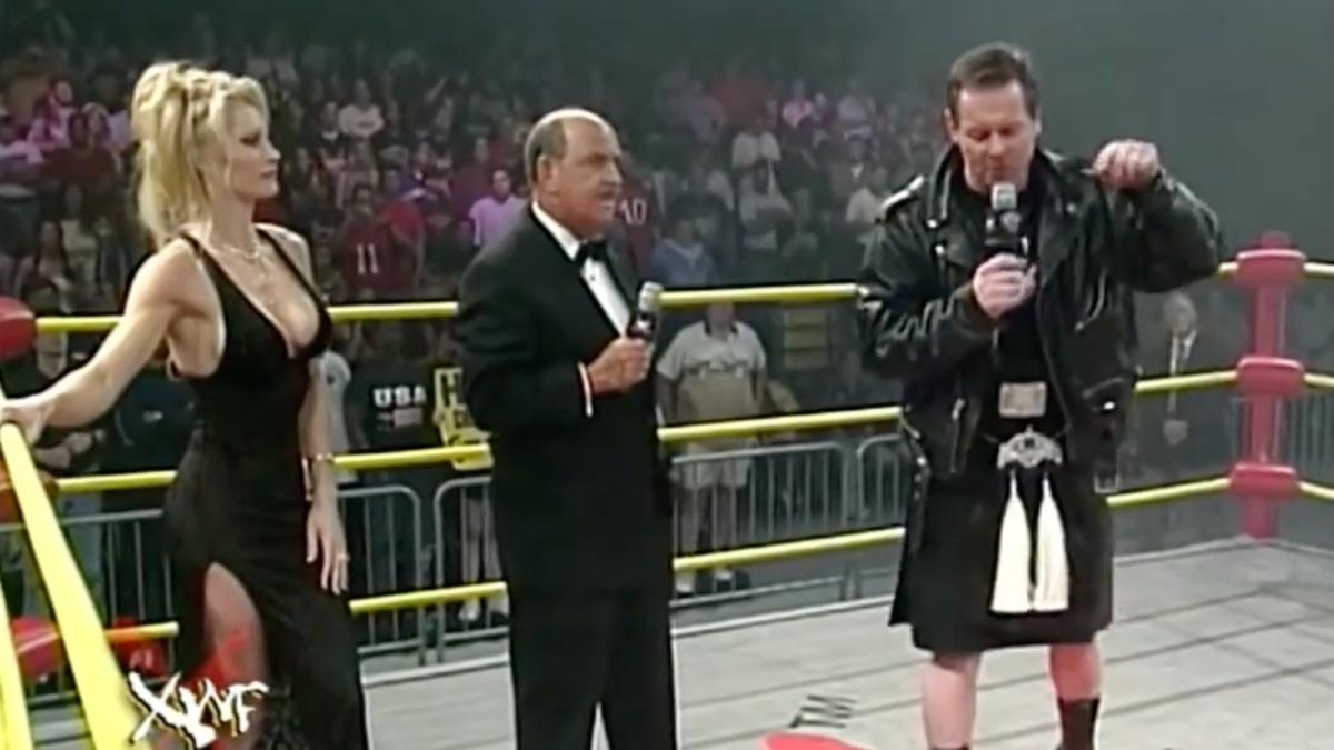 Roddy Piper and Sable talking in the ring between Gene Okerlund at XWF