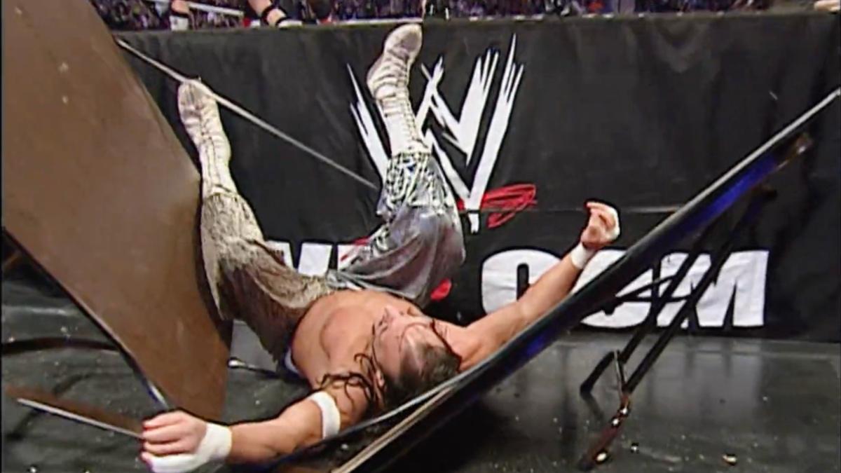 Sabu lying on a crumpled table at WWE Royal Rumble 2007