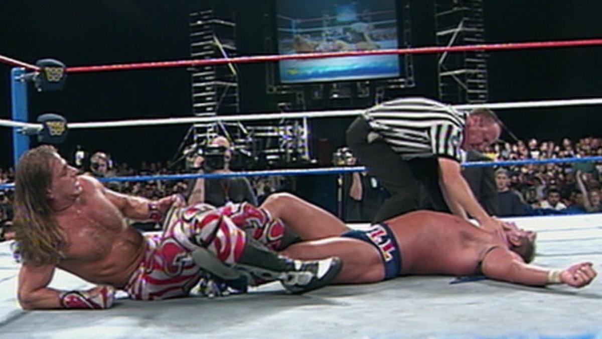 Shawn Michaels with Davey Boy Smith in a figure four leg lock at WWE One Night Only