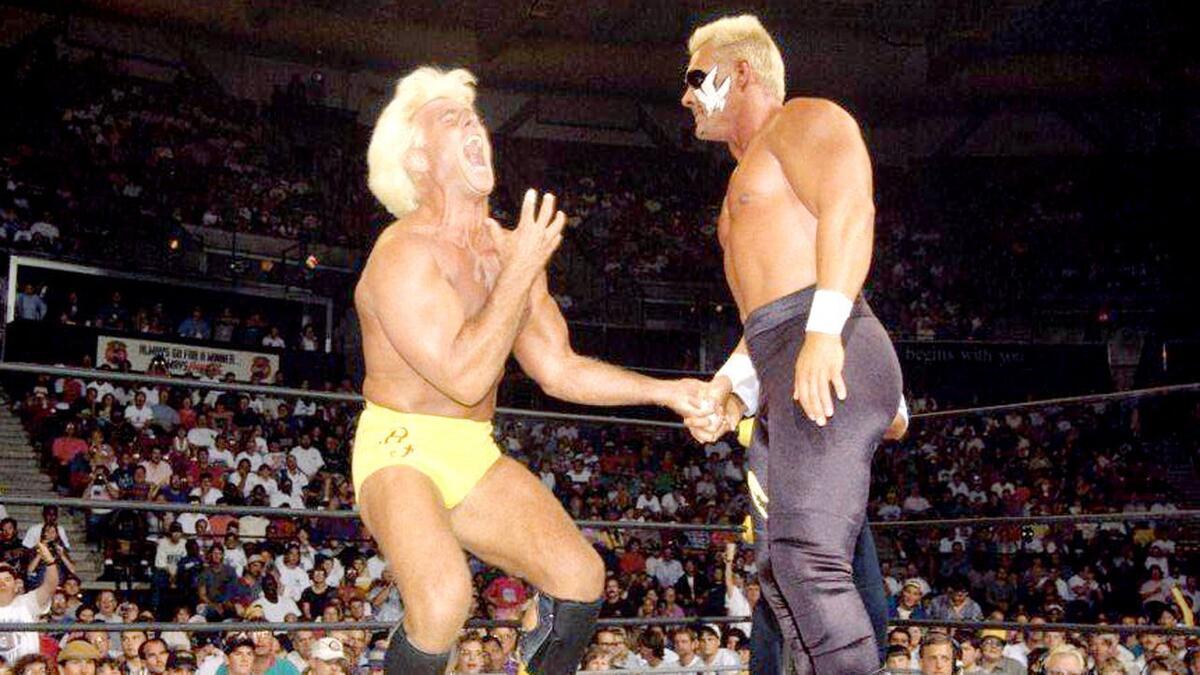 Sting twisting Ric Flair's hand at Clash of the Champions I