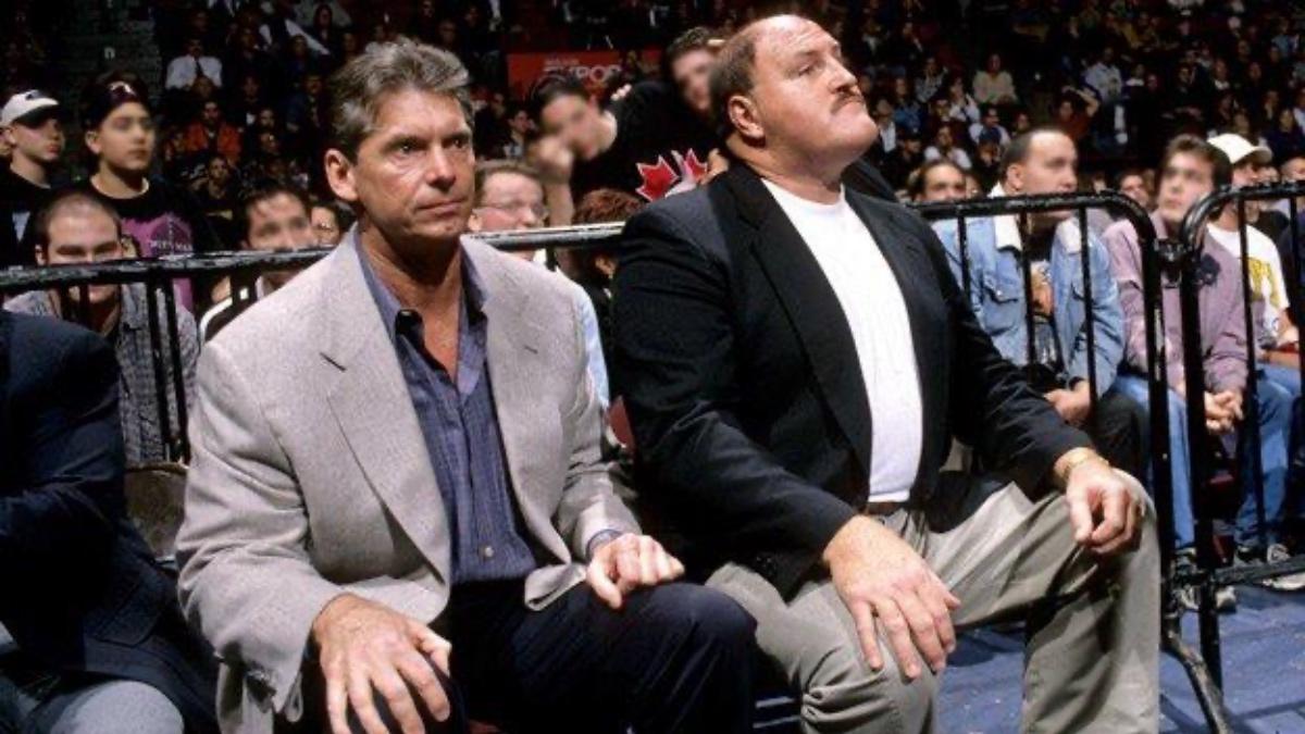 Vince McMahon and Sgt. Slaughter sitting at ringside during the Montreal Screwjob