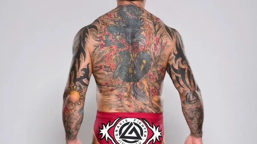 https://cultaholic.com/files/images/1fb6550cf68fa9bfb3682dd4f0d50b91a84c3ad9-batista-back-tattoo.jpg