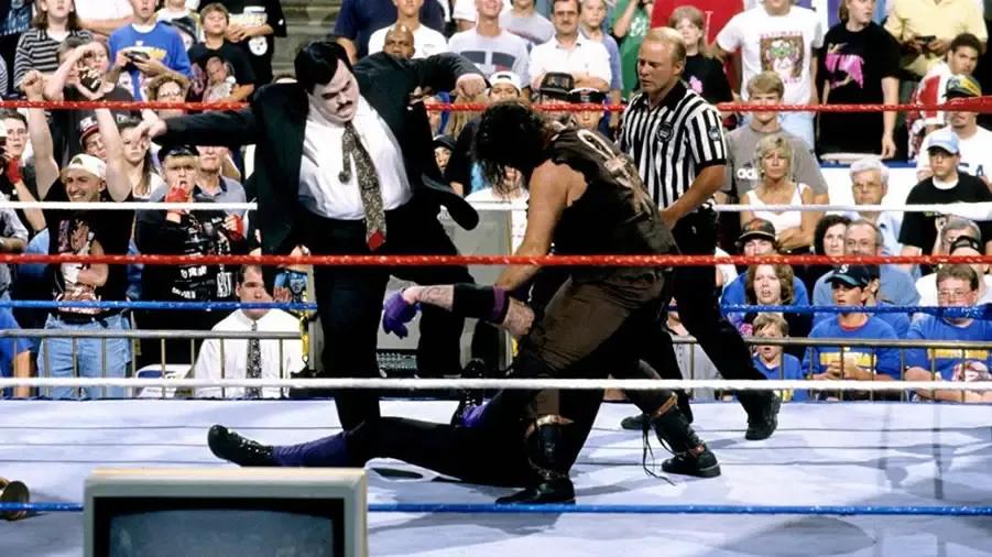 https://cultaholic.com/files/images/5ac364b1c02789df4306d670045a2a0fdad62ad1-the-undertaker-mankind-paul-bearer-summmerslam-1996.jpg