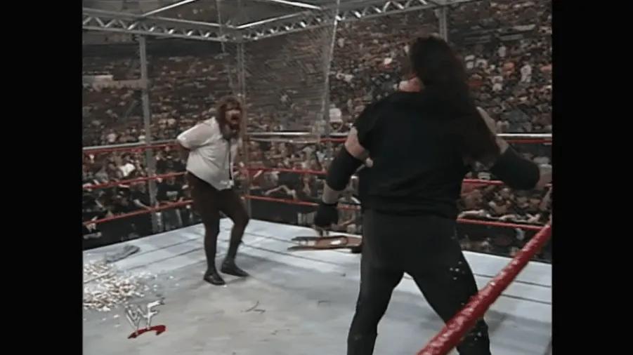 https://cultaholic.com/files/images/dc4ef3f5fc8b85fc4f441fe4b95b3d3f9a1db3ac-the-undertaker-mankind-hell-in-a-cell-king-of-the-ring-1998.gif